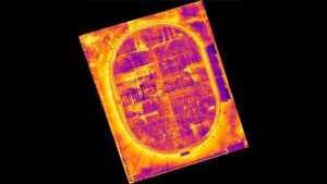 An image taken using aerial thermography. It shows heat signatures of a building