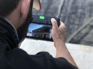 One of our drone pilots controlling a drone and performing an inspection