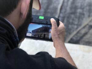 An FAA certified drone pilot flies a drone remotely